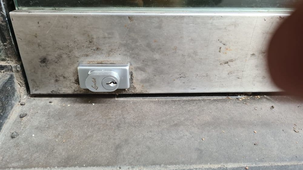 Replace a glass door bottom rail lock